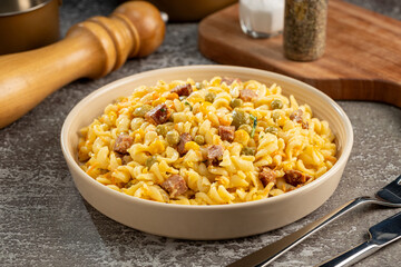 Plate of pasta salad on the table. Macaroni salad.