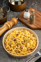 Plate of pasta salad on the table. Macaroni salad.