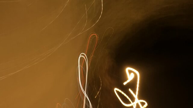 City traffic at night, long exposure image of lights and colors in motion as abstract background, 4K