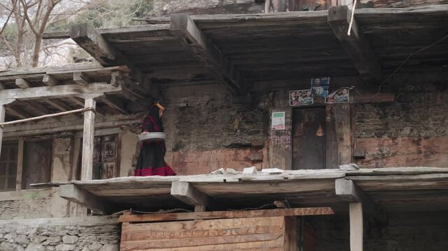 Portrait Young Kalashi Woman, Beautiful Traditionally Dressed girl in in Bumburet Valley at Winter, Chitral, Pakistan.
