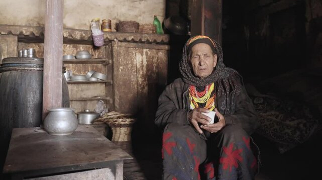 Kalash People. Oldest Woman in Bumburet Valley, Grandmother Kalashi. Elder woman in Hut at Winter, Chitral, Pakistan.