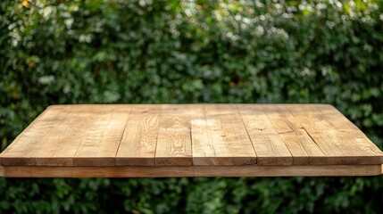 Fototapeta premium Wooden Table Top Against Green Bokeh Background for Stock Images