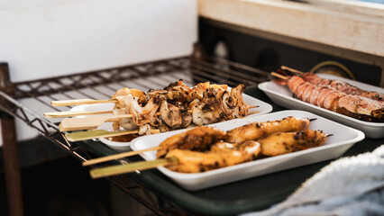 Seafood, oysters grilled, squid and scallop grilled, Matsushima fish market, Sendai, Japan, 21 October 2024. Japanese travel destination. freshness.