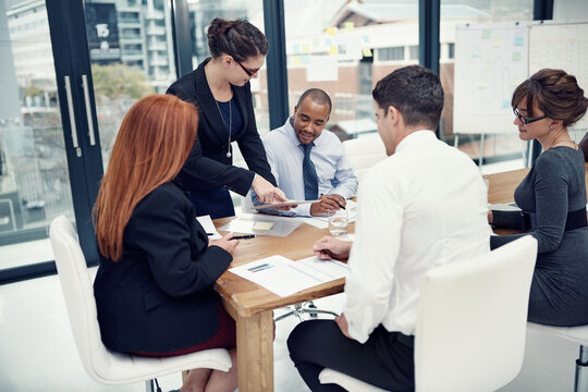 Planning, tablet and mentor with business people in meeting for partnership, data analytics and company revenue. Client feedback, admin stats and research with employees in office for teamwork