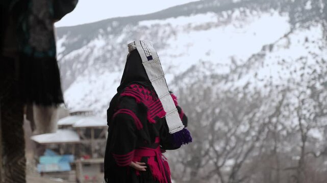 Portrait Young Kalashi Woman, Beautiful Traditionally Dressed girl in in Bumburet Valley at Winter, Chitral, Pakistan.