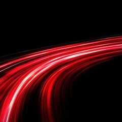 Fototapeta premium Abstract red light trails on a black background.