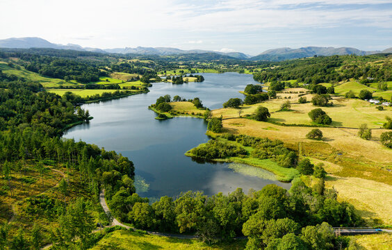 Esthwaite Lake, Lake District National Park, Cumbria. View NW to L-R Wetherlam, Bowfell, Langdale Pikes, Dunmail Raise, Helvellyn, Fairfield. Summer