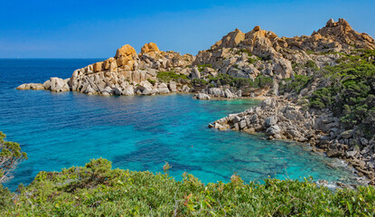 Fototapeta premium beautiful view on the crystalline anturquoise sea borded by cliffs and green plant at Santa Teresa Gallura in Sardinia Italy