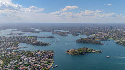 Aerial View of Sydney Harbour Balmain Darling harbour Sydney CBD cockle Bay Wharf North Sydney harbour bridge Lavender Bay Milsons Point Manly on a warm summer day blue skies 