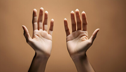 Two hands on a beige background.