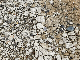 Cracked Cement Surface with Exposed Gravel Details