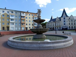 a fountain consisting of several levels and a sculpture depicting three women Chernyakhovsk 2024 July 14