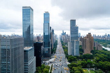 Aerial view of corporate headquarters and towering skyscrapers in a busy city street scene