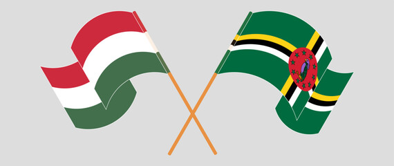Crossed and waving flags of Hungary and Dominica. Vector illustration