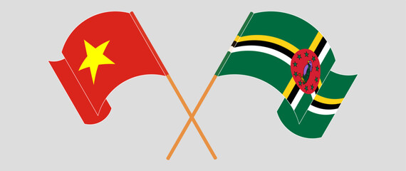 Crossed and waving flags of Vietnam and Dominica. Vector illustration