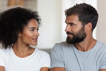 Obraz premium Portrait of a mixed ethnic couple looking at each other at home