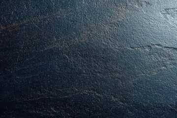 Close-up texture dark slate stone surface subtle variations natural patterns backgrounds designs.