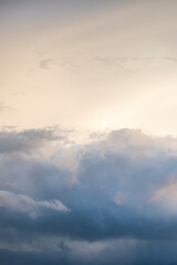 Natural cloudy sky, ornamental clouds, blue sky with light of sunshine having small and large clouds, sky with deep dark clouds and golden. Dense cloudy weather. No AI image, real photo.