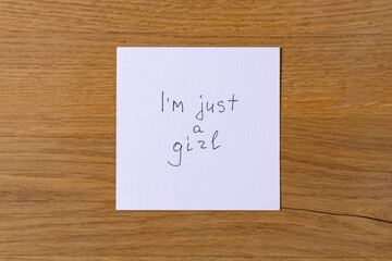Handwritten pink note with 