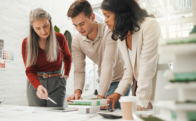 Blueprint, model and tablet with architect people in office together for building or construction...
