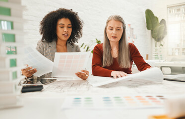 Architecture, collaboration and documents with business women in office together for building or construction. Blueprints, model and planning with property developer team in workplace for engineering