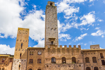 Fototapeta premium Facades of historic buildings on the market square of San Gimignano, Italy