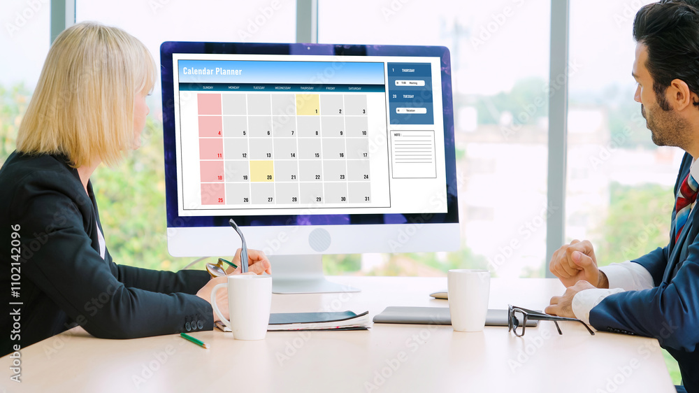 Poster calendar on computer software application for modish schedule planning for personal organizer and on