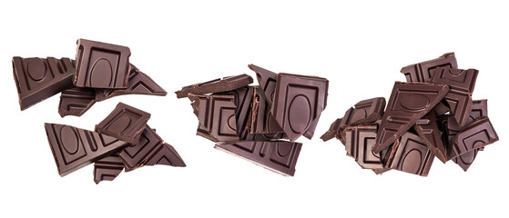 Pile of bitter dark chocolate pieces isolated on a transparent background, top view