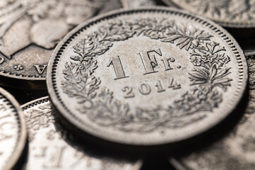 Swiss franc coins. Value of the Swiss Franc and exchange rate trend.
