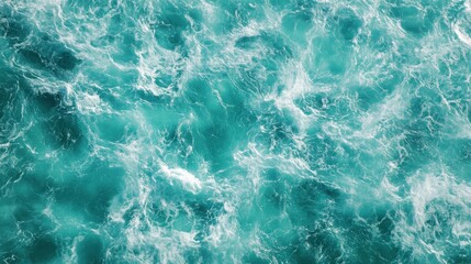 Fototapeta premium Turquoise ocean waves create a dynamic and vibrant coastal atmosphere in mid-afternoon light