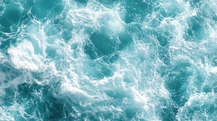 Fototapeta premium Vibrant turquoise ocean waves create a dynamic and captivating surface in bright sunlight