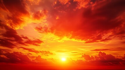 Fiery sunset with vibrant red and orange cloudscape.