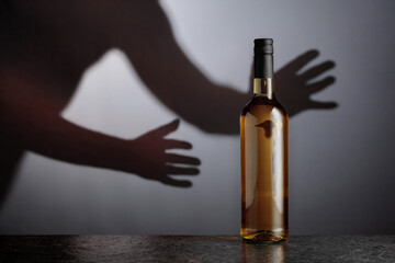 Bottle of white wine on a black table.