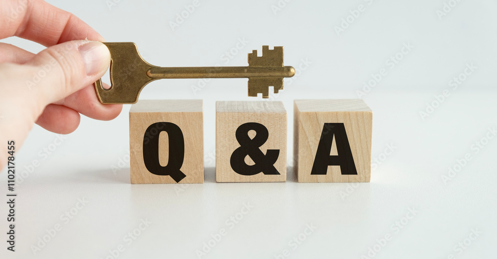Fototapete text q and a on wooden blocks against brown background with copy space. concept of sale and discount