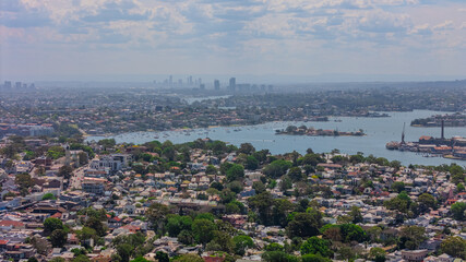 Aerial View of Sydney Harbour Balmain Darling harbour Sydney CBD cockle Bay Wharf North Sydney harbour bridge Lavender Bay Milsons Point Manly on a warm summer day blue skies 