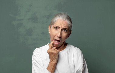  with surprised, nervous, worried or frightened look, looking to the side towards copy space