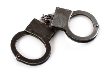 Steel handcuffs on a white background