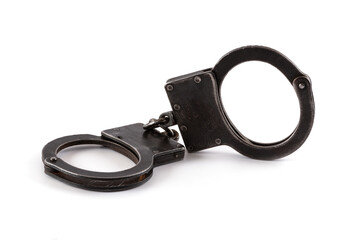Steel handcuffs on a white background