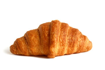 Freshly baked croissant lies on a white background.	