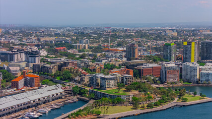 Fototapeta premium Aerial View of Sydney Harbour Balmain Darling harbour Sydney CBD cockle Bay Wharf North Sydney harbour bridge Lavender Bay Milsons Point Manly on a warm summer day blue skies 