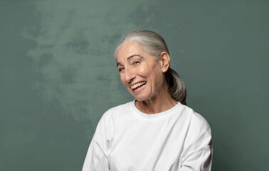  looking happy and friendly, smiling and winking an eye at you with a positive attitude
