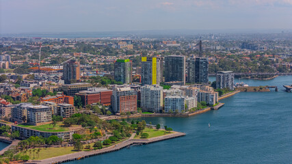 Fototapeta premium Aerial View of Sydney Harbour Balmain Darling harbour Sydney CBD cockle Bay Wharf North Sydney harbour bridge Lavender Bay Milsons Point Manly on a warm summer day blue skies 