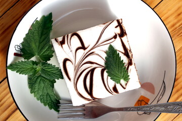 There is a large piece of cake on the plate.	