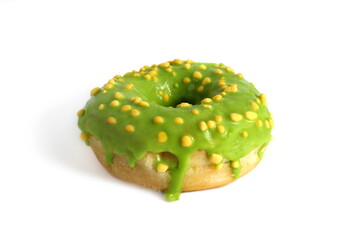 Sweet bun donut with green lies on white background.