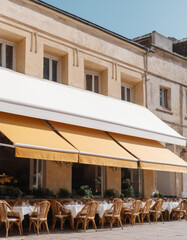 White blank awning tents over cafe windows outdoors. Mockup