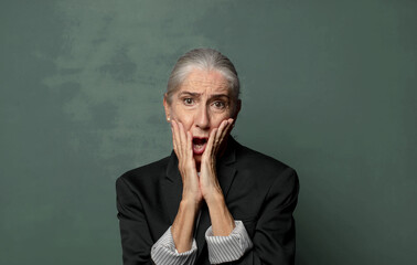  feeling shocked and scared, looking terrified with open mouth and hands on cheeks