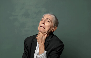  feeling ill with a sore throat and flu symptoms, coughing with mouth covered