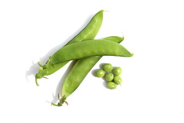 Green fresh peas lie on a white background.	