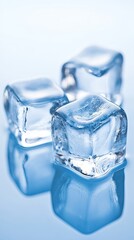 Chilled cubes of crystal clear ice create an inviting and refreshing visual experience in a serene blue setting