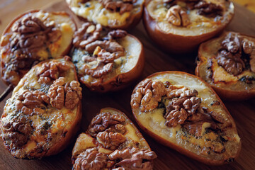 Baked pears topped with walnuts and blue cheese, capturing a rustic and comforting feel
